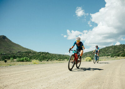 Two mountain bikers on a dirt road